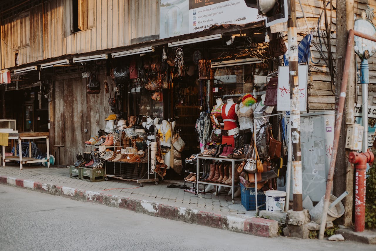 Charming outdoor street market showcasing assorted rustic apparel and accessories.